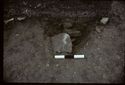 Thumbnail of 1974 photograph of trench in Area B, Site XXIII (Outer Courtyard), showing section of pit and stones.