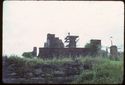 Thumbnail of 1974 photograph of standing buildings in South Range, looking east, with wall of West Front visible in foreground.