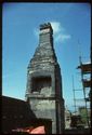 Thumbnail of 1975 photograph, looking west, showing chimney and scaffolding on buildings at South Range.