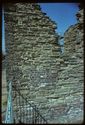 Thumbnail of 1975 photograph, looking west, showing wall of building at South Range, with bricked-up window visible.