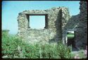 Thumbnail of 1975 photograph, looking north, showing window, wall, and doorway of building at South Range.