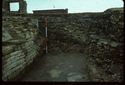 Thumbnail of 1976 photograph of Site XIII (Inner Courtyard), looking south, showing walls of rooms behind Tower A.