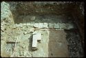 Thumbnail of 1976 photograph of Site XIII (Inner Courtyard), looking east, showing wall and drains of room behind Tower A.