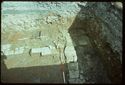 Thumbnail of 1976 photograph of Site XIII (Inner Courtyard), looking north, showing wall and drains of room behind Tower A.