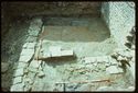 Thumbnail of 1976 photograph of Site XIII (Inner Courtyard), looking south, showing wall and drains of room behind Tower A.