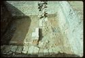 Thumbnail of 1976 photograph of Site XIII (Inner Courtyard), looking west, showing wall and drains of room behind Tower A.