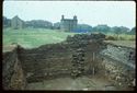 Thumbnail of 1976 photograph of Site XIII (Inner Courtyard), looking west, showing wall and drains of room behind Tower A.