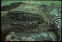 Thumbnail of 1976 photograph of Site XIII (Inner Courtyard), looking west, showing section edge with kiln debris.