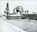 Thumbnail of 1930 black and white photograph, looking west, showing ruins of buildings at South Range.