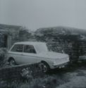 Thumbnail of Black and white photograph, c.1960s, showing car parked in Cruck Building. Handwritten text reads 