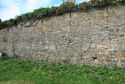 Thumbnail of The change in masonry (16) is visible above blocked openings (9) and (10) here