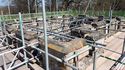 Thumbnail of Supporting scaffold in place around the tower’s parapet at the start of the remedial work