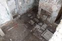 Thumbnail of Flagstones survived at the east end of the tower, at the north-west corner and in the small south block