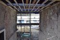 Thumbnail of A view from the south end of the new gate passage. The floor of the rooms above the old gate was roughly at the height of the scaffold board at the far end