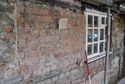 Thumbnail of The blocked first-floor window E, east of the new gate passage, is much larger than the window C over the arch and is set lower in the wall