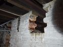 Thumbnail of Breach in partition wall (recently widened) possibly for drive belt. Facing SE