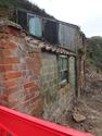 Thumbnail of front west elevation cleared of undergrowth