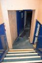 Thumbnail of South facing shot of backstage access from the entrance lobby showing the stairs to the trap room level