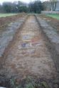 Thumbnail of South-east facing shot of Trench 1 (1m x 1m scale)