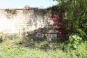 Thumbnail of S. face junction between earliest ashlar wall and red brick retort house wall, view N, 2m.