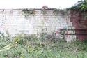 Thumbnail of S. face junction between earliest ashlar wall and red brick retort house wall, view N, 2m.