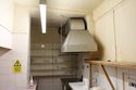 Thumbnail of Overview of southern extent of Room 13. Note the ceiling beam above the extractor hood