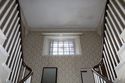 Thumbnail of Stained glass window within southern wall above second floor staircase