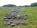 Thumbnail of Figure 82: foundations of the Roman bridge at the secondary position on the River Tees, looking south along the adjusted approach of Dere Street (Margary road 8c).