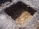 Thumbnail of Oblique shot of Test Pit 12 from the S