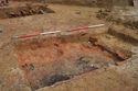 Thumbnail of E-facing oblique Pre-excavation photo of charcoal layer (0143), slot 3