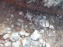 Thumbnail of Close-up of pottery and quern stone - no scale Area B