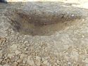 Thumbnail of E. facing section of Pit [1100]. Section 61 Area B