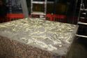 Thumbnail of Detail of die top showing adhesive used to bond die to cap