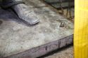Thumbnail of Detail of statue bronze base with lifting straps and ropes