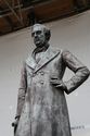 Thumbnail of Detail of statue from waist up, viewed from the north-east