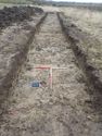 Thumbnail of East facing shot of Trench 19 (1m x 1m scale)
