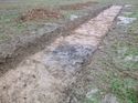 Thumbnail of Photo 1010508 dark deposit within trench 68 taken at Hunts Green Farm