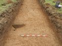 Thumbnail of Possible stake holes and circular pit in Trench 14, looking north.