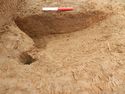 Thumbnail of Possible stake holes and circular pit in Trench 14, looking north.