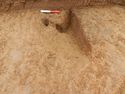 Thumbnail of Possible stake holes and circular pit in Trench 14, looking east
