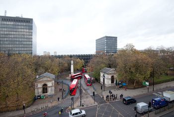 General view of Euston gardens, lodges and railings from the south side of Euston road.