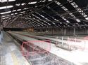 Thumbnail of Detail of the Track Pit, Note the Coach Screws Protruding From Iron Plates Atop the Concrete. Two Iron Chairs Can Be Seen on the Right Still In-Situ. Long Carriage Shed Interior