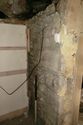 Thumbnail of Photo 099. SbE-facing wall, alcove SbE of sitting room fireplace (flash). Looking SbW. Scale 1m.