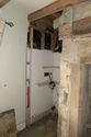 Thumbnail of Photo 101. NbW-facing wall, alcove SbE of sitting room fireplace (flash). Looking SEbE. Scale 1m.