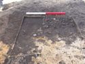 Thumbnail of Intersection of ditch 3101 (filled with stone) and 3102 (cutting 3101)