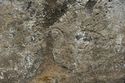 Thumbnail of Pair of eye petroglyphs E02 in quarry bay on  exterior of Rano Raraku