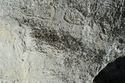 Thumbnail of Pair of eye petroglyphs E12 in quarry bay on exterior of Rano Raraku