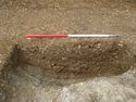 Thumbnail of Area B, N facing longitudinal section of ditch [1025] cutting pit [1022], 1M scale, view from E