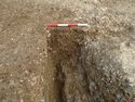 Thumbnail of Area B, S facing section of pit [1022], 0.4M scale, view from S