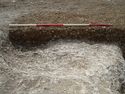 Thumbnail of Area A, NE facing longitudinal section of pit [3097], 2M scale, view from NE